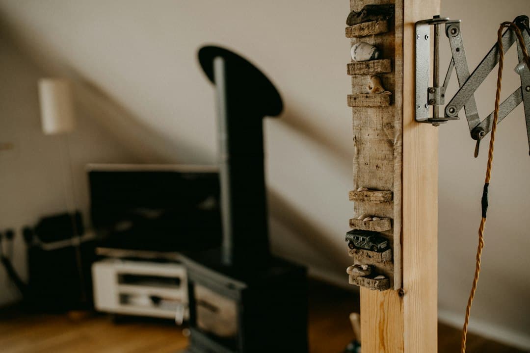A television on a low stand in an attic living room, where a streaming stick plugs in to watch Pixlar8k